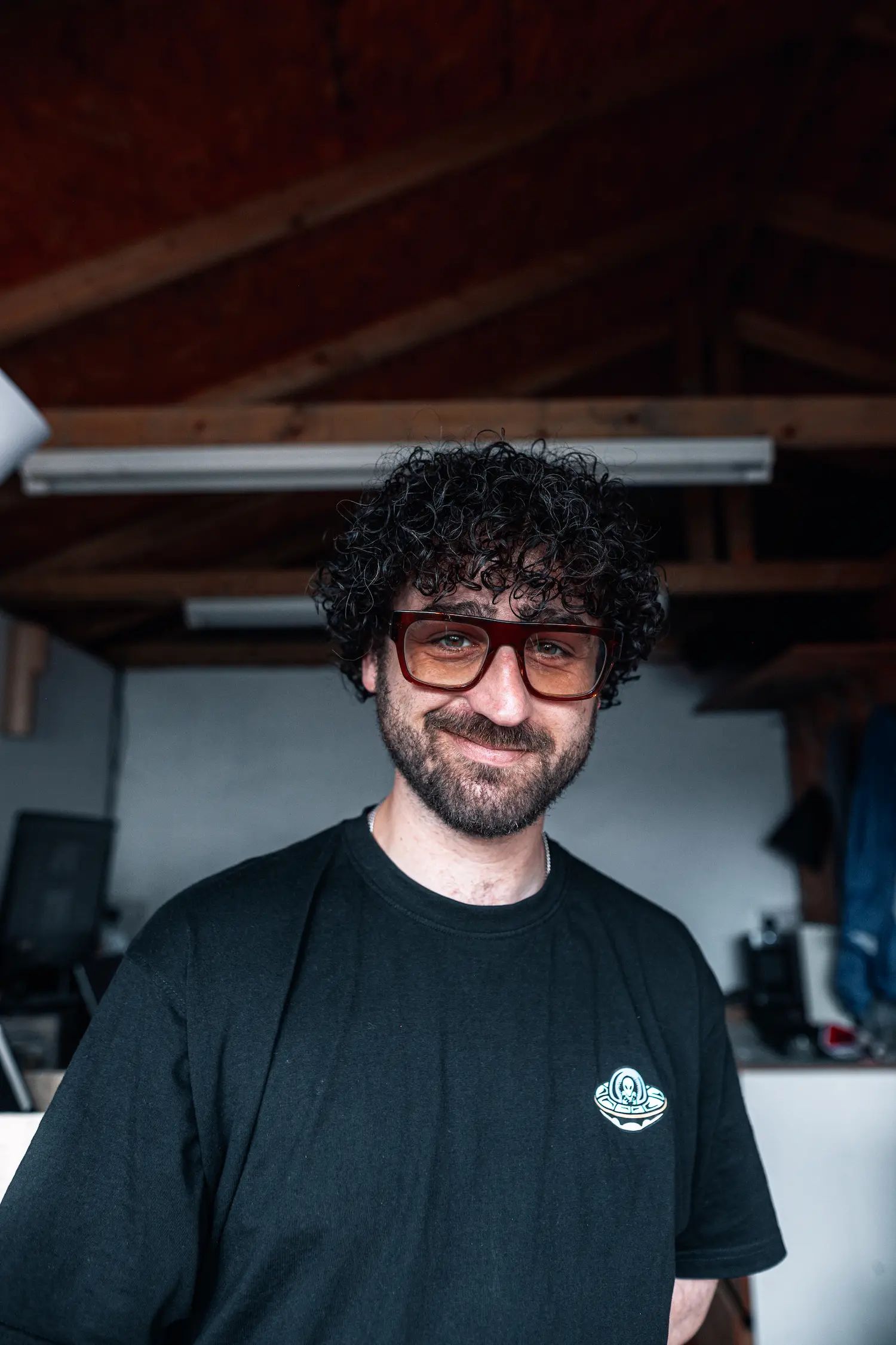 A portrait of James smiling at the camera